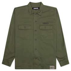 The Neighborhood BDU Shirt L/S makes an impression with its military aesthetic. Composed of cotton, the shirt features a full button-closure at the front. Two chest pockets, a pointed collar, and button cuffs add to the design. The branded woven tag at the hem and screen-printed details wraps up the silhouette. 100% Cotton Button closure Pointed collar Chest pockets Woven tag Button cuffs Style No: 241TSNH-SHM09-OD Green Cotton Utility Shirt, Khaki Button Closure Top For Streetwear, Khaki Top With Button Closure For Streetwear, Streetwear Button-up Shirt With Patch Pockets, Military Streetwear Shirt With Pockets, Military Cotton Shirt For Streetwear, Military Style Cotton Tops With Snap Buttons, Cotton Military Shirt For Streetwear, Utility Cotton Shirt With Buttons