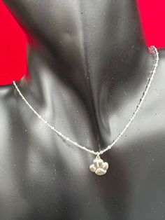 Sterling Silver or 14kt Gold Filled Necklace with Paw CharmSterling Silver 1.2mm Square Beads Link Chainor 14kt Gold Filled 0.6mm Satellite ChainPaw Charm - 10.75mm x 11.50mm (hollow back)Length - 15" with a 3" extender (Total Length 18")** If you need a different size please contact us** Chains are cut to size and are non refundable ** Sterling Silver Charm Necklaces With Round Beads, Silver Charm Necklace With Round Pendant And Satellite Chain, Sterling Silver Pendant With Satellite Chain, Dainty Nickel-free White Gold Jewelry, Dainty White Gold Round Beads Jewelry, Hypoallergenic White Gold Pendant Necklace, Silver Charm Necklaces With Round Beads And Lobster Clasp, Silver Charm Necklace With Round Beads And Lobster Clasp, Silver Charm Necklace With Satellite Chain