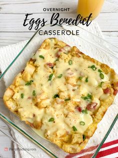 an egg and cheese casserole in a glass dish on a white wooden table