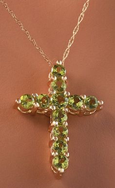 1.20 Carat Natural Green Peridot 14K Solid Yellow Gold Cross Pendant with Chain Amazing looking piece! Suggested Replacement Value: Approx. $1600.00 Total Natural Round Cut Green Peridots Weight: 1.20 Carat Chain Length is: 16 inches Pendant measures: Approx. 25 x 18.4mm Total item weight is: Approx. 2.1g Disclaimer: all weights, measurements and colors are approximate and may vary slightly from the listed dimensions or as seen in the image. All pictures are magnified to show the smallest of det Luxury Yellow Gold Peridot Jewelry, Fine Jewelry Lime Green Gemstone, Luxury Peridot Jewelry For Gifts, Luxury Peridot Multi-stone Jewelry, Luxury Multi-stone Peridot Jewelry, Elegant Multi-stone Peridot Gemstones, Yellow Gold Peridot Gemstone Jewelry, Fine Jewelry Peridot Necklace For Anniversary, Luxury Peridot Jewelry For Formal Occasions