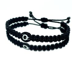 Hand-Made Black String Bracelet With An Evil Eye For Wrist Sizes 6 To 9 Inches, With An Easy To Use Zip Like Function To Fit Your Wrist. Made From High Quality Black String, It Will Be Sure To Last. Wearing An Evil Eye As An Amulet Is Believed To Provide Protection Against Evil Forces. The Evil Eye Meaning Has Symbolism In Almost Every Country In The World And In Every Religion. Each Bracelet Is Carefully Handcrafted And Give Proper Time To Ensure Quality. Casual Black Braided Bracelets For Everyday, Casual Black Braided Bracelet For Everyday, Casual Black Beaded Bracelets For Friendship, Black Resizable Jewelry, Trendy Black Braided Bracelets With Sliding Knot, Casual Black Jewelry With Adjustable Band, Trendy Adjustable Bracelet With Black Band, Adjustable Black Bracelet For Everyday, Trendy Black Braided Bracelet With Sliding Knot