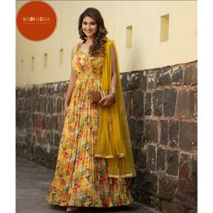 1. Introducing our exquisite yellow floral printed anarkali suit, a true embodiment of elegance and grace. Crafted with meticulous attention to detail, this resplendent ensemble showcases a vibrant yellow hue adorned with delicate floral patterns, evoking a sense of timeless beauty. The flowing anarkali silhouette gracefully drapes around the body, enhancing the wearer's femininity and exuding an air of regal sophistication. Perfect for special occasions and festivities, this enchanting ensemble Floral Print Long Dress, Printed Anarkali, Fabric Work, Print Long Dress, Floral Print Dress Long, Anarkali Suit, Dress Gown, Floral Patterns, Yellow Floral