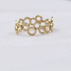 "Very chic and trendy jewelry piece, this gold filled ring is handmade with a unique and stylish design. A chic piece you can wear with other dainty, stacking rings to create your own wonderful style. Why purchase this gold ring? One you can wear on an everyday basis and mix or match with other pieces✅ The ring is expertly handmade with craftsmanship and high-quality materials ✅ Available in ring sizes 5 to 10 ½ US ✅ Wearable alone or with other stacking ring pieces ✅ Thoughtfully packaged in a Gold Stackable Circle Rings As Gift, Gold Stackable Rings As Gift, Gold Stackable Rings Made Of Recycled Gold, Gold Midi Rings For Promise, Round Shape, Modern Gold Stackable Rings, Hypoallergenic Gold Plated Round Rings, Hypoallergenic Gold-plated Rings, Yellow Gold Circular Jewelry With Ring Detail, Yellow Gold Open Circle Ring For Gift