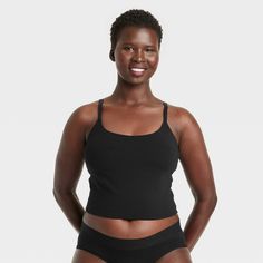 Give your everyday intimates a comfy upgrade with this Cotton Stretch Crop Cami Bralette from Auden™. This crop cami bralette is made of cotton jersey fabric with added spandex for a flexible fit that moves with you, while opaque lining provides extra coverage. The adjustable straps help you find the right fit, and unlined, wireless cups round out the design for support that maintains a natural, comfortable shape. Plus, removable padding provides a customized coverage. Auden™: Comfort true to ev Black Cotton Sports Bra With Built-in Bra, Fitted Scoop Neck Bra For Loungewear, Fitted Cotton Sports Bra With Seamless Construction, Medium Support Camisole Tank Top With Built-in Bra, Medium Support Cami Sports Bra With Built-in Bra, Seamless Sports Bra With Medium Support And Tank Straps, Scoop Neck Sports Bra With Adjustable Straps For Loungewear, Stretch Cotton Camisole With Built-in Bra, Fitted Seamless Cotton Sports Bra