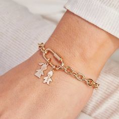 Celebrate love and connection with our Personalized Lucky Charm Mini Family Bracelet. Add up to five hand-engraved mini people charms to represent your loved ones and little ones, all moving freely within a screw clasp oval locket. This chunky bracelet chain is perfect for wearing alone or as a bold addition to your bracelet stack, with each personalized charm a symbol of unbreakable bonds and memories together.18K Champagne Gold PlatedCharms measure: 0.5 x 0.3 (Mini Girl, Mini Boy)Chain links: Crystal Dice, Family Bracelet, Mini People, Love And Connection, Family Bracelets, Oval Locket, Chunky Bracelet, Chunky Bracelets, Celebrate Love