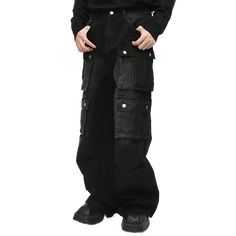 Embrace utility and style with these black multi-pocket cargo jeans, featuring large flap pockets for a bold, functional look. The wide-leg fit offers comfort and versatility, perfect for casual streetwear or edgy, utilitarian outfits. A must-have for anyone looking to combine fashion with practicality. Baggy Cargo Jeans For Urban Adventures, Edgy Straight Leg Cargo Jeans With Cargo Pockets, Edgy Straight Leg Cargo Pants With Pockets, Urban Cargo Jeans With Multiple Pockets, Baggy Cargo Jeans With Side Pockets For Winter, Y2k Style Cargo Pants With Pockets For Fall, Y2k Style Black Bottoms With Pockets, Urban Jeans With Multiple Pockets, Streetwear Cargo Jeans For Fall Full Length