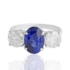 a blue sapphire and diamond three stone ring