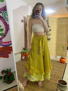 This unique wrap skirt is a one of a kind in the hole world ✨ The fabric goes on it's one unique story as it is a  one of a kind recycled vintage silk hand picked from unique places and villages 🌱 The fabric also  is so soft and silky and has so many small details that make just that much more Beautiful  ⚛️ It's a 2 in 1 skirt ! As you can where it in its 2 defrent sides✨ Skirt is great for every day, And also luxurious and Stunning for evening where. 🌞 Fabric is is the best thing about it, An Silk Tiered Skirt, Silk Wrap Skirt Outfit, Flowy Wrap Skirt, Bohemian Maxi Skirt For Festivals, Flowy Ruffled Skirt For Festival, Bohemian Skirt For Festivals, Bohemian Festival Skirt, Green Bohemian Maxi Skirt With Boho Print, Green Bohemian Maxi Skirt For Festival