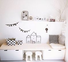 a white room with black and white decorations on the wall