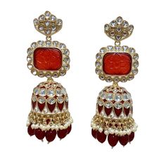 The Maroon Jiya Earrings are unique, and lightweight Jhumkas with Kundan, Meenakari and Gold-Plating on beautiful hydro beads. Specifications Materials used: Kundan, Meenakari, hydro beads, Gold Plating Weight: 41 g Height: 3.5 inches At Romikas, we pride ourselves on the craftsmanship and high quality of our jewelry, designed to enhance your natural beauty. Please contact us with any questions. Traditional Cutdana Dangle Jhumkas, Traditional Dangle Jhumkas, Traditional Cutdana Jhumkas Dangle, Meenakari Bridal Earrings For Puja, Bridal Meenakari Earrings For Puja, Traditional Cutdana Jhumkas, Traditional Dangle Jhumkas For Diwali, Traditional Jhumkas For Diwali, Festive Latkan Earrings For Puja