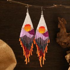 A fun vibrant beautiful beads tassel drop Earrings with sun, sunset & mountains, perfect for summer/spring. They will make any outfit pop! Summer Festival Tassel Earrings, Multicolor Tassel Earrings For Summer Beach, Bohemian Dangle Beaded Earrings For Vacation, Bohemian Beaded Earrings For Vacation, Bohemian Multicolor Tassel Earrings For Beach, Orange Tassel Jewelry For Summer, Summer Beach Tassel Earrings With Dangling Beads, Bohemian Summer Dangle Tassel Earrings, Summer Bohemian Dangle Tassel Earrings