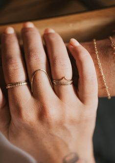 Jess hand-styled this stack just for you. She loves it, we love it, you'll love it! 5mm band width when worn together. We hammered flat our Teeny-Tiny band, Valley Ring and Beaded Ring to unite forces and create an eye-catching combo. Available in 14kt Gold Fill + Sterling Silver. Shown with our Dani Chain Ring and Swell Ring. Handmade in Eau Claire, WI. Our jewelry is handmade so each piece will be unique and may vary slightly from what is pictured. Left Hand Rings, Heirloom Stackable Rings, Tarnish Resistant, Everyday Heirloom Style Tarnish Resistant Stackable Rings, Adjustable Stackable Promise Jewelry, Minimalist Double Band Stackable Promise Rings, 14k Gold Hammered Stackable Promise Rings, Dainty Open Band Promise Jewelry, Everyday Stackable Double Band Jewelry, Fine Jewelry Stackable Midi Rings For Promise