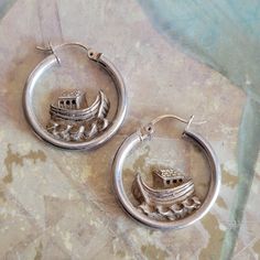 This is a pair of vintage, sterling silver, Noah's Ark, hoop, earrings, for pierced earrings. They have tested positive for silver. All sales are final. These earrings measure 24 mm across. If you have a wish list or are looking for something specific, please ask. I may have exactly what you are looking for. As always please convo me with any questions or concerns regarding this item or with any international shipping questions. Unfortunately I do not accept returns or grant refunds. All shipping fees include handling fees. If you would like to combine shipping costs for more than one item, I would be happy to do so if you convo me before purchase. Purchasing my item means you have read, understood and will abide by my policies. Sorry, I do not accept trades. A bit about reserving Items. I Noah's Ark, Noahs Ark, Pierced Earrings, Jewelry Earrings Hoops, Wish List, Pierced Ears, Earings Piercings, Vintage Sterling Silver, Ear Piercings