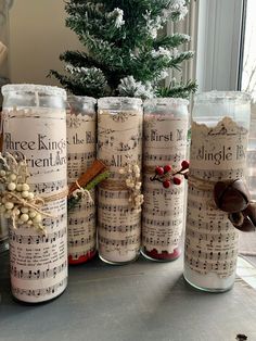 there are many jars that have musical notes on them, and one has a christmas tree in the background