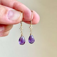 Amethyst Earrings, February Birthstone, Purple Teardrop Dangle Earrings, Minimalist Earrings Gold or Silver, Dainty Amethyst Jewelry Gift These precious delicate earrings feature Brazilian Amethyst teardrops adorned with a white topaz connector in either gold filled or sterling silver. The purple drop earrings are suspended from lever back ear wires in the finish of your choice. These earrings are very feminine and subtle, perfect for every day. These make a perfect daily earring, or a fantastic Elegant Amethyst Teardrop Dangle Earrings, Delicate Gemstone Drop Earrings, Dainty Purple Gemstone Earrings, Elegant Purple Earrings For Everyday, Amethyst Teardrop Crystal Earrings, Everyday Gemstone Drop Earrings, Dainty Amethyst Dangle Earrings, Minimalist Purple Drop Earrings, Amethyst Teardrop Earrings For Pierced Ears