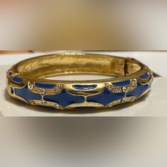 Beautiful Ornately Designed Bangle With Gold Accents. Blue Cuff Bracelet Bangle For Formal Occasions, Blue Bangle Cuff Bracelet For Formal Occasions, Adjustable Blue Cuff Bracelet For Party, Trendy Blue Bangle Jewelry, Formal Blue Bangle Cuff Bracelet, Trendy Blue Formal Jewelry, Blue Bangle Cuff Bracelet For Party, Adjustable Blue Bracelet For Formal Occasions, Trendy Adjustable Blue Cuff Bracelet