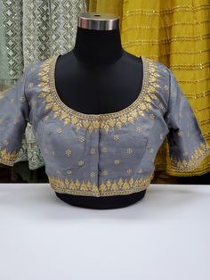 Fancy raw silk blouse with gold embroidery Blouse has 2 inch margins on each side to make it bigger Ready to ship Online only Designer Embroidered Top With Traditional Drape, Festive Designer Embroidered Top With Intricate Embroidery, Anarkali Embroidered Top For Navratri With Intricate Embroidery, Designer Embroidered Top For Festive Occasions, Elegant Embroidered Top For Designer Festivals, Elegant Chanderi Top With Floral Embroidery, Transitional Reception Tops With Resham Embroidery, Elegant Tops With Intricate Embroidery In Chanderi, Elegant Chanderi Tops With Intricate Embroidery