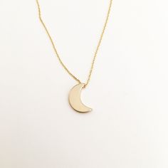 Simply sweet. The perfect dainty piece for every day wear! Wear your initial, your spouse, or your child! These necklaces are perfect for the minimalist. You can wear this alone, or as a layering piece. Makes the perfect gift for your girlfriend, wife, wedding party, or of course, yourself! Gold plated chain measures 15 inches with 1.5 inch extender, making it 16.5 inches as well. Moon is appx 9X6 mm Simple Charm Necklaces For Mother's Day, Elegant Everyday Crescent Charm Necklace, Minimalist Tiny Charm Necklaces For Mother's Day, Simple Everyday Charm Necklaces For Mother's Day, Minimalist Crescent Necklaces For Everyday, Simple Rose Gold Charm Necklace For Everyday, Everyday Minimalist Crescent Necklaces, Minimalist 14k Gold Filled Initial Necklace Gift, Classic Crescent Jewelry As A Gift