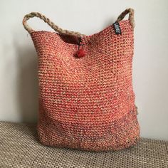 "Handmade crochet bag of natural materials. Great as shopping bag, festival bag, summer beach bag. Material: Linen Main colours: orange Colouring: red/beige/yellow/blue Sizes: Height handle 54 cm - 21\" Height 36 cm - 14\" Width 32 cm - 12.5\"" Red Handwoven Crochet Travel Bag, Red Woven Crochet Travel Bag, Red Woven Crochet Bag For Travel, Fair Trade Crochet Beach Bag, Fair Trade Jute Crochet Bag For Beach, Red Woven Crochet Bag For Vacation, Natural Crochet Bag For Festival, Natural Crochet Festival Bag, Casual Multicolor Handwoven Crochet Bag