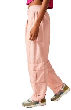 A slouchy fit and lightweight design mean these sporty pants with a plethora of pockets and a high waist are perfect for going from the studio to the street. 29" inseam; 18" leg opening; 12" front rise; 16 1/2" back rise (size Medium) Zip fly with hook-and-bar closure Partial ribbed elastic waist Side-seam pockets; back welt pocket; cargo bellows flap-patch pockets Roll-up cuffs with snap 70% cotton, 30% nylon Machine wash, line dry By Free People; imported Trendy Relaxed Fit Tapered Leg Cargo Pants, High Waist Pink Relaxed Fit Cargo Pants, Pink High Waist Relaxed Fit Cargo Pants, Pink Relaxed Fit High Waist Cargo Pants, Relaxed Fit Pink Cargo Pants With Side Pockets, Pink Relaxed Fit Parachute Pants With Side Pockets, Spring Relaxed Fit Joggers With Pockets, Spring Utility Sweatpants With Relaxed Fit, Spring Utility Style Relaxed Fit Sweatpants