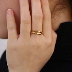 Modern yet timeless, the gold wave ring features a split shank. It is the stylish but simple piece you've been looking for. Wear it alone or stack with other rings to make a statement look. 18k gold plated Stainless steel based Waterproof and tarnish free Available in US size 6-8 Ring sizing chart Gold Minimalist Stackable Bypass Ring, Minimalist Gold Stackable Bypass Ring, Gold Stackable Rings With Polished Finish And Modern Twist, Gold Stackable Rings With Modern Twist, Gold Minimalist Bypass Ring With Polished Finish, Modern Twist Gold Stackable Rings With Open Band, Gold Stackable Rings With Open Band In Modern Style, Gold Stackable Rings With Open Band And Modern Twist, Minimalist Gold Plated Stackable Rings With Polished Finish