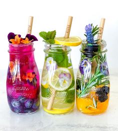 three mason jars filled with different types of drinks