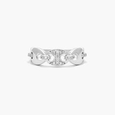 a white gold ring with diamonds on the sides and an intertwined design in the middle