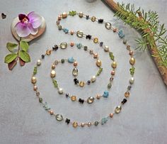 "MY GEMS ROCK -45\" length -Petite gemstone in peridot;  Garnet chips; Aquamarine chips -Labradorite -cultured freshwater pearls -Crystal rondelles -Can be worn as a double-strand https://www.etsy.com/shop/MYGEMSROCK" Gemstone Lariat Necklace, Handmade Jewlery, Color Necklace, Gold Long Necklace, Long Beaded Necklace, Station Necklace, Layered Jewelry, Freshwater Cultured Pearls, Beads And Wire