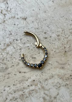 Chevron Hinged Hoop For Nose Ear Daith and More  * Made of 14K yellow gold * Features 1.3up 2mm black natural diamond prong setting  approx. 0.20 carat of diamonds  * Diamond Clarity -VS-SI  * Diamond Color - Black  * Great for septum and Cartilage available in 14 ,16 and 18 gauge  More Natural Gemstones available: Ruby, Emerald , Sapphire ,Topaz Opal and Black diamonds  Made in USA 🇺🇸  We are a U.S. based seller  All of our products are shipped from within the United States. Minimalist Jewelry With Black Diamonds And Black Spinel, Fine Jewelry With Black Diamonds In Gold, Fine Jewelry Gold Jewelry With Black Diamonds, Fine Jewelry Gold With Black Diamonds, Fine Jewelry In Gold With Black Diamonds, Minimalist Yellow Gold Jewelry With Black Spinel, Minimalist Round Black Diamond Jewelry, Gold Jewelry With Black Spinel, Gold Jewelry With Round Black Spinel