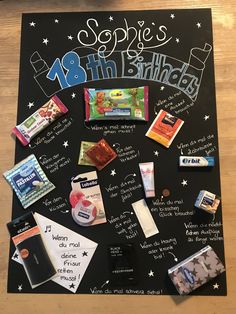 a blackboard with some food on it and writing all over the board, as well as other items