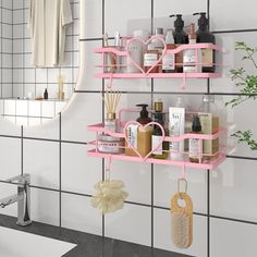 a bathroom with two pink shelves on the wall