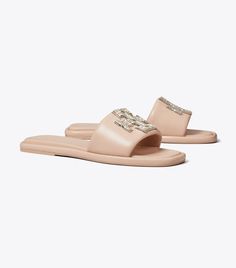 Double T Deco Sport Slide: Women's Designer Sandals | Tory Burch Luxury Synthetic Slip-on Slides, Luxury Slides With Cushioned Footbed, Luxury Slides With Textured Footbed For Spring, Luxury Synthetic Slides, Luxury Spring Slides, Luxury Flat Slides With Cushioned Footbed, Luxury Cushioned Slides Flat, Luxury Cushioned Flat Slides, Luxury Slides With Cushioned Footbed And Flat Heel