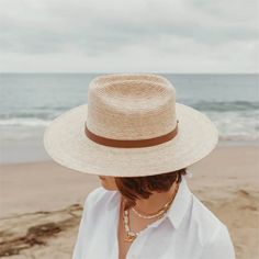 a little western and a little unexpected in the best ways - meet the moonlight straw rancher, a statement hat that's not just for country concerts and riding horses. the moonlight is handcrafted with fine tripilla palm straw that's been sustainably harvested by artisans in puebla, mexico. wear this straw hat for a long day outdoors, offering UPF 50+ sun protection and a large, structured, 4" brim to help shield your face from harmful rays. the cattleman style crown and toasted caramel straw colo Woven Straw Panama Hat For Rodeo, Straw Woven Panama Hat For Rodeo, Woven Wide Brim Straw Hat For Rodeo, Wide Brim Woven Straw Hat For Rodeo, Natural Hat Band With Flat Brim For Country Events, Natural Woven Fedora For Rodeo, Western Straw Hat With Wide Brim, Adjustable Straw Hat With Flat Crown For Country Events, Western Wide Brim Woven Straw Hat