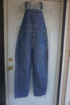 Vintage blue denim overalls by Webs. Size M. Please see measurements. In overall good vintage condition with light stain and tiny hole as seen in photos.Measurements taken across front laid flat18" across front of waist22" across hips14" rise31" inseam43" length from waist down Blue Denim Overalls, Mens Overalls, Denim Overalls, Light Stain, Levi Jeans, Mom Jeans, Blue Denim, Overalls, Stain