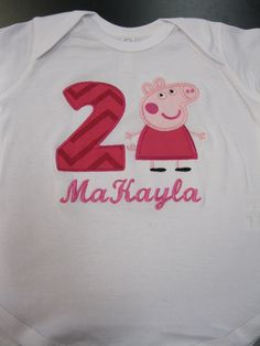 a white bodysuit with peppa the pig on it's chest and number two