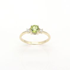 14k Peridot Diamond Ring | 5.0MM Natural Peridot Engagement Ring | 14k Peridot Wedding Ring | August Birthstone Ring | 14k Peridot Ring | Handmade Jewelry P R O D U C T 𝄪 D E T A I L S ✽ Metal: 14k Yellow Gold, White Gold & Rose Gold ✽ Bottom Band Width: 1.5 MM ✽ Stone Size: Natural Peridot 5.0 MM x 1pc (approx. 0.5ct) / Natural Diamond 2.3 MM x 2pcs (approx. 0.10ct) ✽ Diamond Color: G ✽ Diamond Clarity: VS2-SI1 ✽ Made to Order ✽ Same Design in Different Birthstone:   - Garnet: https://etsy.me/ Yellow Gold Peridot Ring, Yellow Gold Peridot Diamond Ring With Birthstone, Yellow Gold Peridot Birthstone Ring, Green Three-stone Birthstone Ring In 14k Gold, Fine Jewelry Peridot Birthstone Ring In Round Cut, Green Three Stone Birthstone Ring In 14k Gold, Fine Jewelry Peridot Birthstone Ring Round Cut, Yellow Gold Peridot Diamond Ring, Fine Jewelry Peridot Birthstone Ring