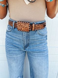 Made with quality hand-tooled vegetable tanned cowhide leather, this unisex leather belt is all that you need to pair with your jeans to make an amazing western fashion statement.The Belt comes with a high quality antique finish metal buckle in engraved texture.The heavy duty buckle is easy to remove and replace so you can change the buckle if you wish. It adds a flair to your outfit and gives it a western look.These belts measure from the fold of the leather to the center hole. It has two inch 2.5” Western Belt For Women, Cavenders Belts, Cadillac Belt Buckle, Tooled Leather Belts Women, Ranching Life, Western Belts For Women, Summer Rodeo, Buckle Bunny, Leather Tool Belt