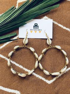 "Queen of Cowrie Hoops// Cowrie Hoop Earrings, African Jewelry, Statement Earrings, Cowrie Shell Earrings, Afrocentric, African Hoop Earrings \"Whoever is patient with a cowrie shell will one day have thousands of them\" -- Hausa proverb Get your hands on these 3 inch hoop earrings made of polished cowrie shells from the sea wrapped in brass wire. Be ready to receive tons of compliments as these hoops will be a show stopper! Earring is light and will not put pressure on earlobe.  Cowrie shells r Nickel-free Bohemian Earrings For Vacation, Bohemian Nickel Free Earrings For Vacation, Bohemian Nickel-free Earrings For Vacation, Bohemian Earrings With Ear Wire For Vacation, Bohemian Drop Earrings For Vacation, Nickel-free Bohemian Earrings For Beach, Bohemian Nickel-free Earrings For Beach, Bohemian Ear Wire Jewelry For The Beach, Bohemian Ear Wire Jewelry For Beach