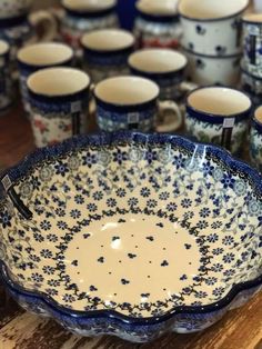 many blue and white bowls are on the table