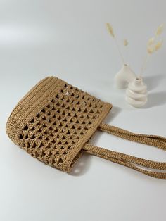 🌸Meet our wicker knitted bags made of natural raffia. This handmade Tote Bag is very stylish, lightweight and the perfect summer accessory. Our stylish shoulder bag in natural color will look great with any summer outfit. This unique design makes it a unique bag. Elegant design, perfect for daily use, shopping or going out. 🌸Every detail of this Tote Bag has been produced with the highest level of craftsmanship and carefully considered. Its sufficiently large internal volume is large enough to Crochet Wicker Bag, Summer Beige Crochet Bag Made Of Yarn, Braided Rattan Crochet Bag Rectangular, Braided Rattan Crochet Rectangular Bag, Lightweight Bohemian Brown Straw Bag, Lightweight Brown Bohemian Straw Bag, Bohemian Lightweight Brown Straw Bag, Brown Braided Crochet Bag For Beach Season, Vacation Crochet Rattan Bag