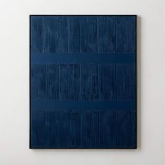 a blue painting on a white wall