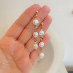 Add a touch of timeless elegance to your collection with these classic freshwater pearl hook earrings. Each earring features a lustrous freshwater pearl, renowned for symbolising purity and wisdom. Perfect for June birthdays, these pearls are also the birthstone for the month, making them a meaningful gift for yourself or a loved one. The delicate hook design ensures comfort and sophistication, suitable for any occasion. Elevate your style with these versatile and beautiful earrings. Materials : Classic Pearl Chain Earrings, Classic Round Pearl Chain Earrings, Pearl White Akoya Pearl Earrings With Pearl Chain, Pearl White Akoya Pearl Chain Earrings, Graceful Pearl White Dangle Pearl Earrings, Elegant Pearl Drop Earrings With Round Beads, Akoya Pearl Dangle Earrings In Pearl White, Pearl White Akoya Pearl Dangle Earrings, Akoya Pearl Dangle Earrings