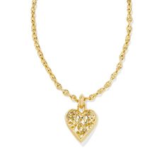 Sweet, always-on-trend, and full of shine, you can't help but fall for the Romy Statement Heart Necklace. Centered on a textured chain, this oversized heart pendant is the pop of personality your layered look needs. Designer, founder, and philanthropist Kendra Scott started her company in 2002, just three months after her first son was born. Her commitment to innovation, quality, customer service, and detail has taken her from a small startup to a billion-dollar brand. Kendra Scott is known for Kendra Scott Heart Necklace Clear, Necklace Inspiration, Necklaces Gold, Bow Necklace, Gold Choker Necklace, Gold Heart Necklace, Gold Choker, Accessories Jewelry Necklace, Gold Pendant Necklace