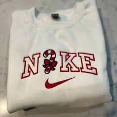 Not Nike Brand Please Allow Up To A Week To Ship Design Size Is 7x5 -Unisex Sizing True To Fit -Embroidered Design -Use Gildan Brand For Crewnecks, However There May Be A Substitute For A Similar Brand -Available In S, M, L, Xl, 2xl Size Of Design Is The Same For All Sizes Of Crewnecks So Design Will Look Smaller On A 2xl Compared To A S Material Is 50/50 Cotton/Polyester *Colors May Vary Slightly* Christmas Sweatshirt Ideas, American Eagle Sweatshirt, Ship Design, Carhartt Hoodie, Embroidered Nike, Quarter Zip Hoodie, Candy Cane Christmas, Velour Hoodie, Christmas Graphic