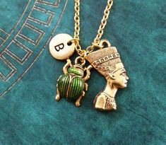 Nefertiti Necklace SMALL Scarab Necklace Personalized Jewelry Egyptian Jewelry Egyptian Necklace Gre Green Charms Jewelry Perfect For Gifts, Adjustable Vintage Charm Pendant Jewelry, Adjustable Vintage Charm Pendant Necklace, Personalized Vintage Metal Jewelry, Symbolic Charm Necklaces With Vintage Charm As Gift, Symbolic Charm Necklaces With Vintage Charm For Gifts, Symbolic Charm Necklace With Vintage Charm As Gift, Symbolic Vintage Charm Necklace For Gift, Personalized Metal Bohemian Necklaces