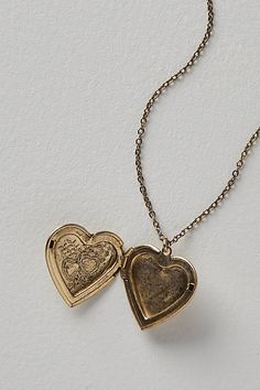 A super sweet gift or an accessory unique to you, this darling monogram necklace features a heart locket pendant with an initial engraving. **Features:** Dainty chain, heart locket pendant, hinge opening mechanism, monogram initial engraving, clasp closure **Why We | Monogram Necklace by Free People in Gold Personalized Vintage Heart Necklace For Valentine's Day, Personalized Vintage Heart Necklace For Mother's Day, Vintage Charm Heart Pendant Jewelry For Mother's Day, Vintage Locket Charm Necklace For Mother's Day, Mother's Day Vintage Heart Pendant Jewelry, Vintage Personalized Heart Charm Necklaces, Personalized Vintage Heart Charm Necklaces, Personalized Heart-shaped Vintage Charm Necklaces, Vintage Personalized Heart Pendant Necklace