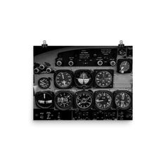 a black and white photo of an airplane cockpit with many different gauges on it