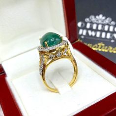 "ENJOY OUR WORRY-FREE SERVICE AND THE DAZZLING, GENUINE JEWELRY WE DESIGN AND HANDCRAFT WITH LOVE❤️ ABOUT THE ITEM: This ring is the perfect combination of elegance, beauty, and INVESTMENT VALUE! With a TRANSPARENT, 6.50 carats, VIVID FOREST GREEN emerald, and 52 extremely sparkling diamonds. The 18K yellow gold ring was deliberately designed and handcrafted by our boutique's in-house goldsmiths. You will love this gorgeous piece as much we do. And people will absolute adore it once they see the Luxury Diamond Cabochons For Wedding, Formal Hallmarked Diamond Cabochons, Luxury Cabochon Diamond Ring For Formal Occasions, Luxury Diamond Cabochons For Formal Occasions, Yellow Gold Diamond Cabochons Fine Jewelry, Luxury Formal Cabochon Diamond Ring, Luxury Gold Emerald Round Ring, Luxury Gold Emerald Ring, Classic Gold Cabochon Diamond Ring