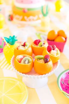 there are fruit cups on the table ready to be eaten and served for desserts