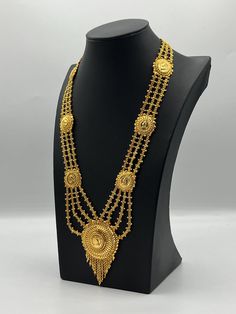 Indulge in the rich heritage of South Asia with our captivating necklace, a dazzling fusion of Indian, Pakistani, and Nepali influences. Inspired by the opulence of traditional jewelry, this exquisite piece showcases intricate craftsmanship and vibrant gemstones, reminiscent of royal adornments from the subcontinent. Embellish your neckline with its enchanting design, meticulously crafted to capture the essence of South Asian splendor. Elevate your style and embrace the cultural tapestry of Indi Bollywood Style Gold-plated Tilla Necklace, Bollywood Style Festive Filigree Necklace, Traditional Round Necklaces For Eid, Hallmarked Gold Plated Necklaces For Diwali, Gold Bollywood Necklace For Eid, Bollywood Style Hallmarked Gold Necklace, Diwali Gold Plated Necklace With Intricate Design, Round Jewelry For Eid Celebration, Eid Celebration Round Jewelry